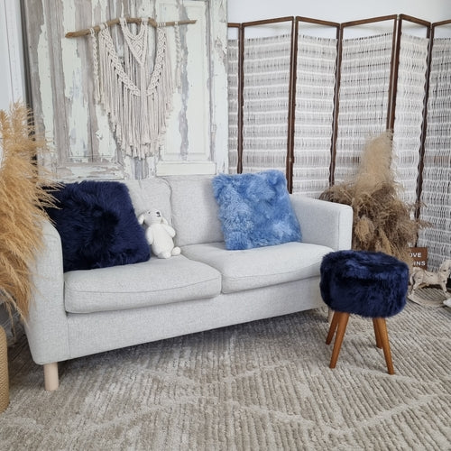 Dark blue genuine sheepskin stool with oak legs