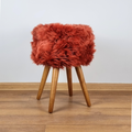 Red genuine sheepskin stool with oak legs